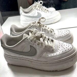 Nike white and silver shoes